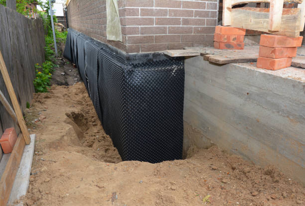Happy homeowners after waterproofing job in Bannister